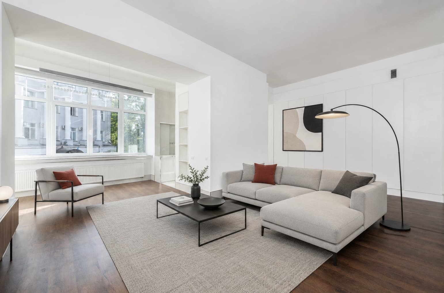 A room shown empty and then staged with furniture